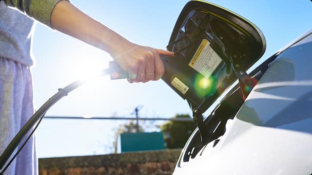 Electric vehicle charging at a public charging station
