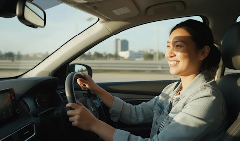 Person driving a car